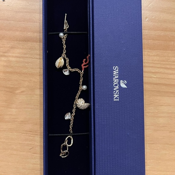 Swarovski Jewelry - NEW Swarovski Ocean Charm Bracelet Gold Tone Crystal Shell Coral Pearl Dangle
